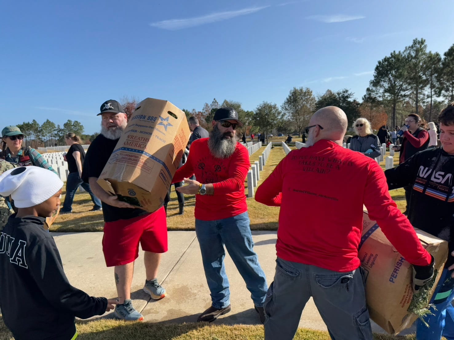 Bearded villains members unloading wreaths from a truck at the Jacksonville national cemetary